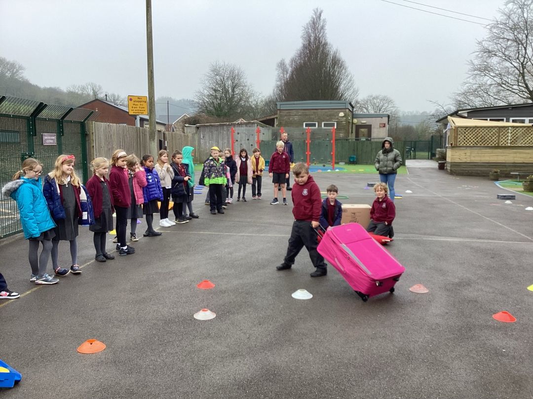 Children taking part in a relay race on the playground