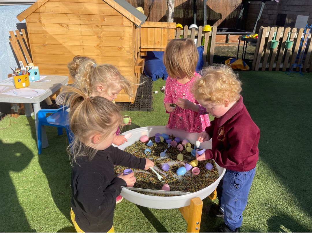 Little Acorns preschool children exploring outdoor play and learning.