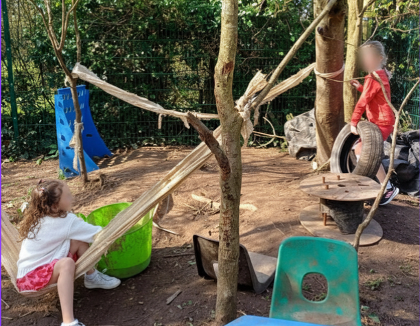 Children building a den in the willow tunnel