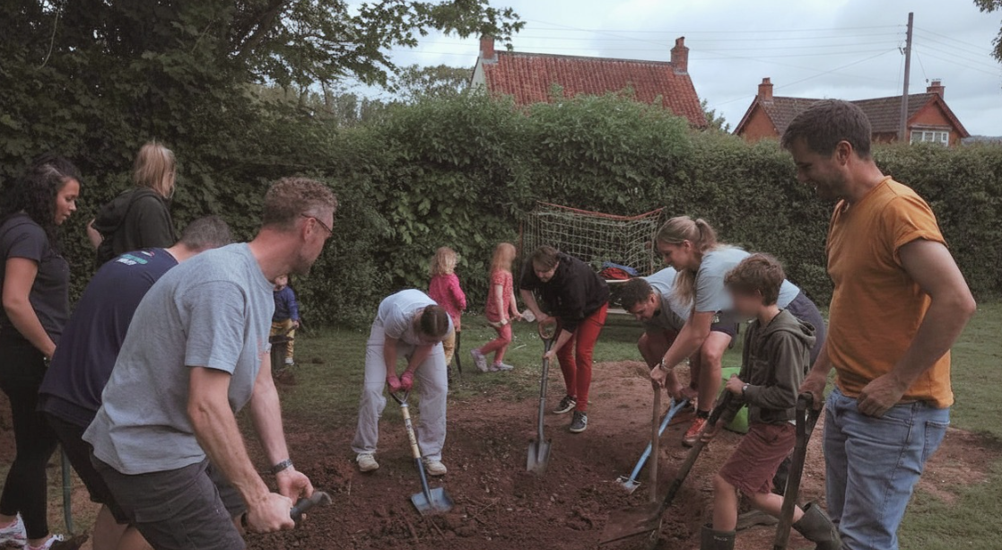 Families helping to dig a sand pit